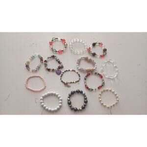 $Bundle 13 bracelets Ranging from Crystal plastic wood metallic beading.